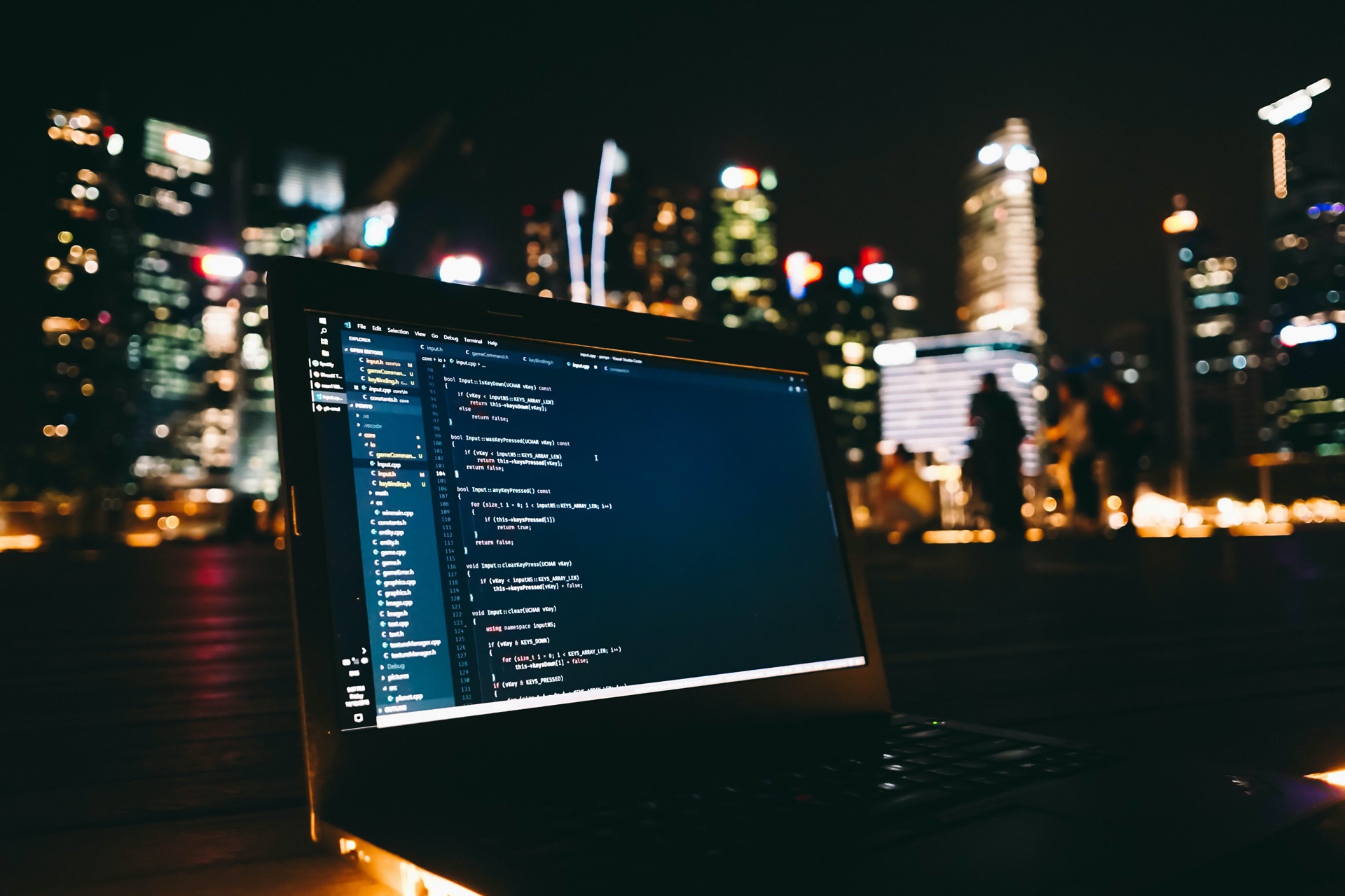Dark photo of laptop showing code by Sean Lim on Unsplash